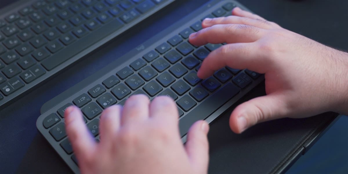 Person typing on a keyboard